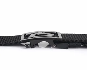 Detail of black nylon belt featuring adjustable matte metal buckle mechanism