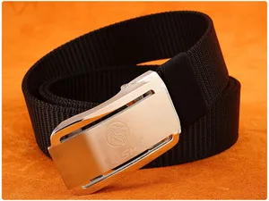 Detail of silver zinc alloy automatic buckle with lion logo on black nylon tactical belt