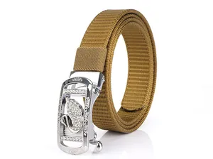 Macro detail of khaki nylon canvas belt featuring a sparkling swan crystal buckle