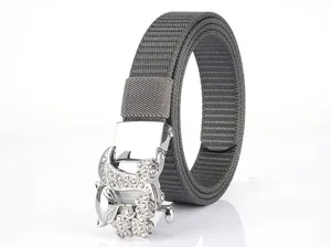 Close-up of grey woven nylon belt featuring a luxury rhinestone encrusted silver buckle