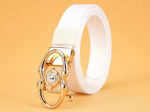 Close-up of white woven nylon belt featuring a gold metal buckle with crystal accents