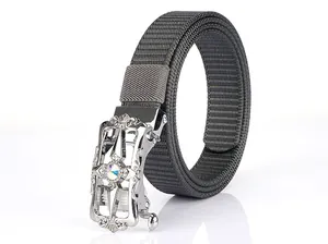 Detailed view of grey nylon canvas belt with silver automatic buckle and ornate engraving
