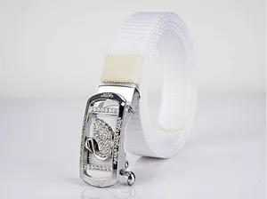 Detail showing white woven nylon belt with silver swan buckle and sparkling rhinestones