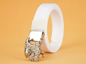 Detailed macro view of white nylon belt featuring a luxury floral rhinestone buckle