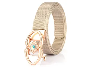 Close-up of rose gold automatic buckle with rhinestones on a woven nylon belt