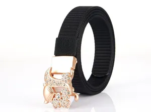 Detailed view of rose gold fox buckle with rhinestones on a black nylon belt