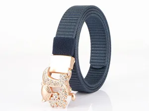 Detail of navy blue nylon belt with rose gold fox-shaped buckle and white crystals