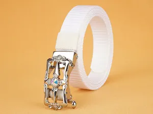 Detail of white nylon woven belt with vintage silver alloy buckle and colorful rhinestone