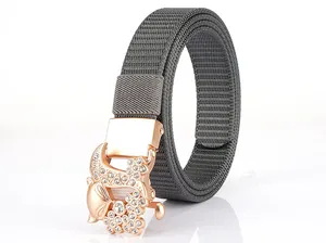 Detailed macro view of dark grey nylon belt with a rose gold fox-shaped rhinestone buckle