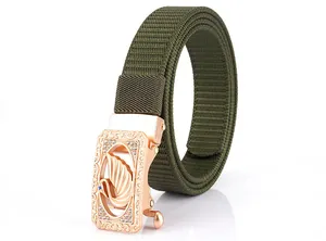 Detail of rose gold alloy buckle with swan relief and crystals on green nylon belt