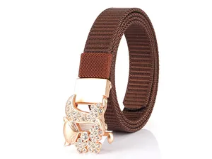 Close-up of rose gold fox buckle with rhinestones on brown woven nylon canvas belt