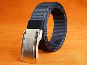 Close-up of navy nylon belt with silver brushed metal buckle and engraved logo