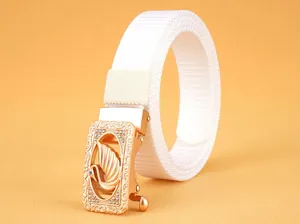 Detail of white nylon belt with golden swan buckle and pavé crystal rhinestones