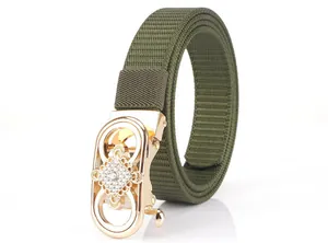 Detail of army green nylon belt with gold rhinestone automatic buckle and mechanism