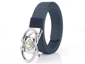 Detail of blue nylon woven belt featuring a silver automatic buckle with a colorful rhinestone