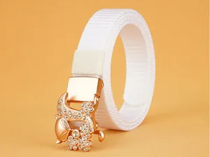 Detail of white nylon belt with rose gold fox-shaped buckle encrusted with crystals