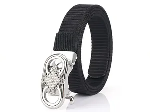 Close-up of black nylon belt with a silver automatic buckle featuring diamond rhinestones