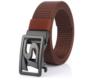 Close-up of brown woven nylon belt with black matte automatic buckle featuring S cutout