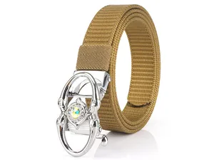 Close-up of khaki woven nylon belt featuring a silver buckle with sparkling rhinestone inlay