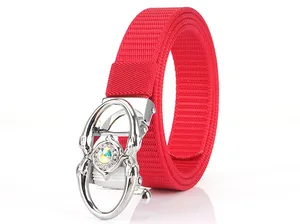 Detail of red nylon belt with silver automatic buckle featuring large colorful rhinestones