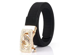 Detail of black nylon strap with golden alloy swan buckle and sparkling rhinestones