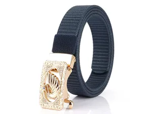 Detail of dark blue nylon belt with golden swan buckle and sparkling rhinestones