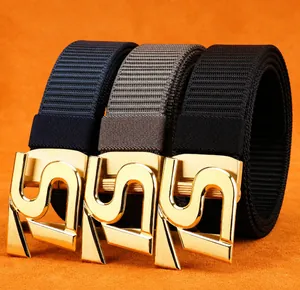 Detailed view of durable woven nylon belts in navy, gray, and black with gold S-buckles