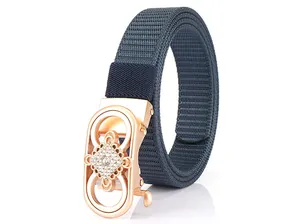 Close-up of rose gold automatic buckle with rhinestones on navy nylon belt
