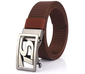 Macro detail of dark brown woven nylon belt with brushed metal automatic buckle