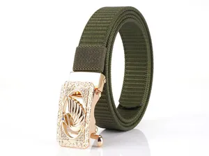 Detailed view of army green nylon belt with gold automatic buckle featuring a swan logo