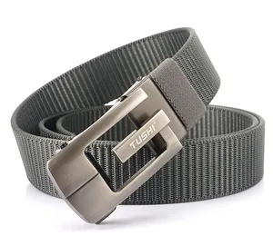 Detail of grey nylon belt showing twill weave texture and brushed metal automatic buckle