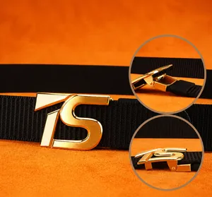 Detail showing the automatic golden TS buckle with a quick-release mechanism for belts