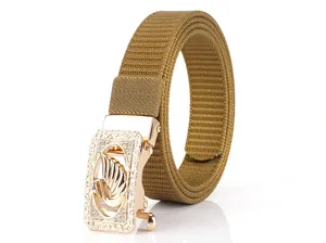 Detailed shot of khaki nylon belt with golden alloy buckle featuring a swan crystal motif