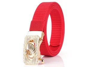 Detailed view of red nylon woven belt featuring a gold swan buckle with crystal inlay