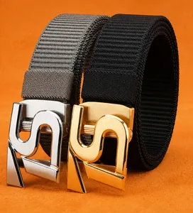 Detail of stainless steel automatic buckles with nylon belts on textured background