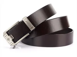 Close-up of brown leather belt with brushed alloy automatic buckle and wolf emblem