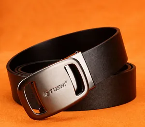 Detail of TUSHI business belt featuring a brushed metal automatic buckle and real leather