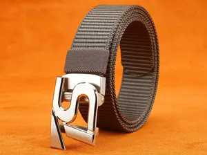 Close-up of brown nylon belt with brushed silver buckle featuring an S-shaped design