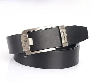 Detail view of gunmetal automatic buckle with lion relief and black leather texture