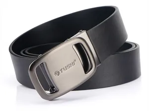 Detail of black leather belt with a brushed metal automatic buckle and logo engraving