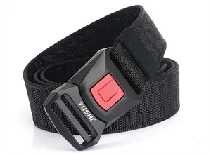 Detail of nylon tactical belt featuring a matte black buckle with red release button