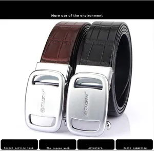 Detail of genuine cowhide leather belts with embossed crocodile texture and metal buckle