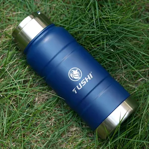 Outdoor 520ml stainless steel vacuum flask with matte blue finish on green grass
