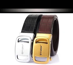 Detail of men's leather belts with crocodile pattern and stylish alloy auto buckles
