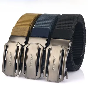 Three colors of durable nylon belts with metal automatic buckles on reflective surface