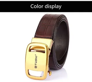 Detailed macro view of dark brown alligator grain leather belt with a gold buckle