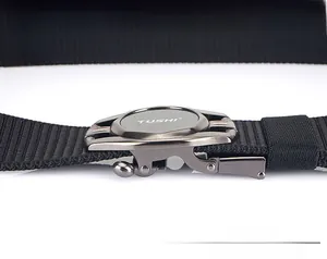 Detailed macro of black nylon tactical belt buckle with matte alloy finish and woven texture