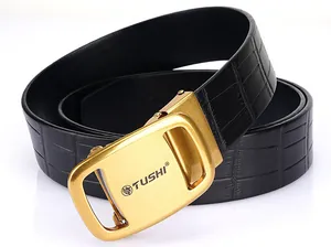 Close-up of gold automatic buckle with animal logo and black crocodile embossed leather belt