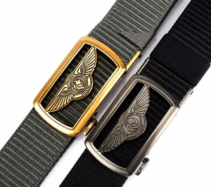 Close-up of tactical nylon belts with metal buckles featuring embossed eagle wing patterns