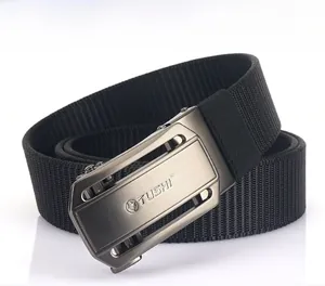 Macro detail of black nylon belt with matte gunmetal lion-head automatic buckle